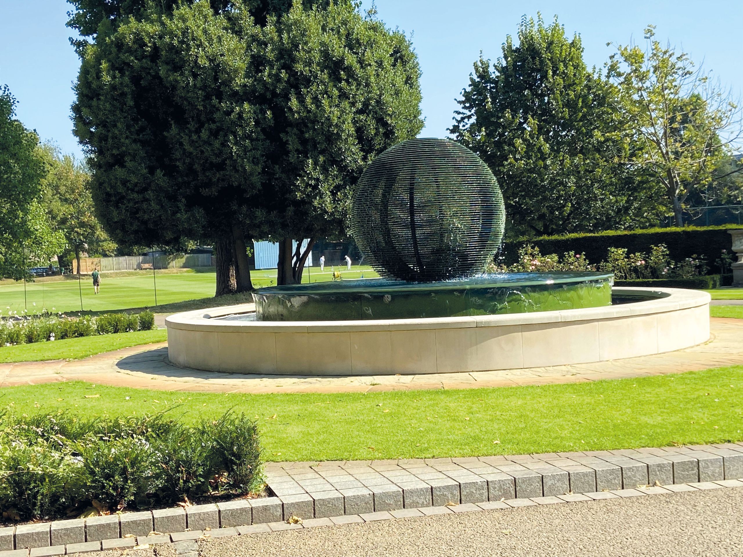 a couple of people are swimming in a cave